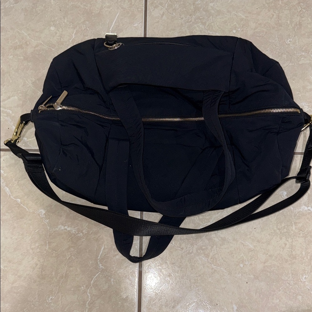 Lululemon On My Level Barrel Black Duffel Bag with Gold Accents